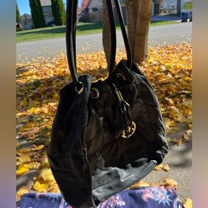 Michael Kors Black Leather Purse w/ Tassle and large MK gold logo
